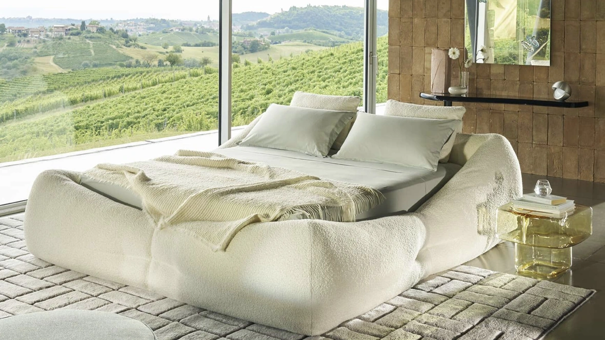 Letto imbottito Mon-Nid con box contenitore di Cassina