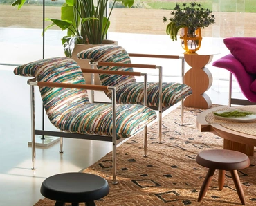 Poltroncina di design in tessuto Esosoft di Cassina