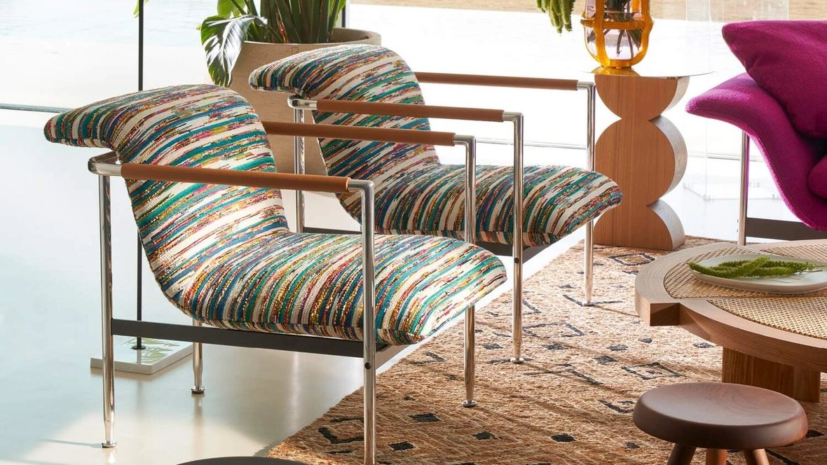 Poltroncina di design in tessuto Esosoft di Cassina