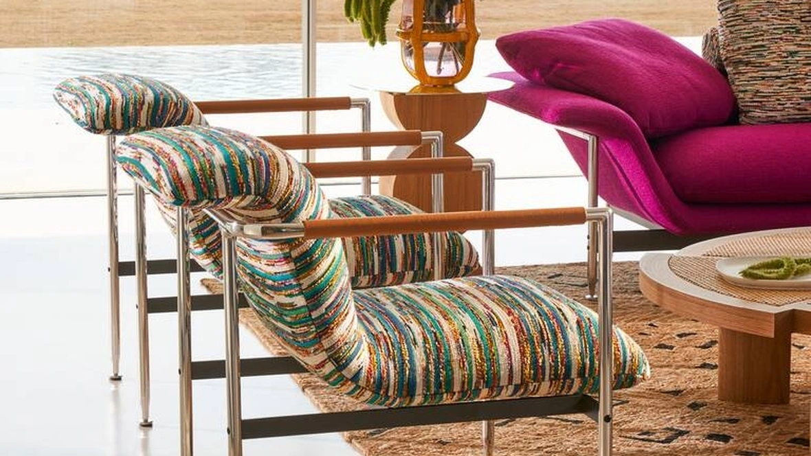 Poltroncina di design in tessuto Esosoft di Cassina