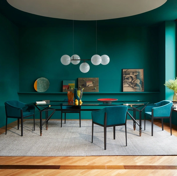 Tavolo Olimpino con top in vetro e struttura in metallo verniciato con piedini in legno massello di Cassina