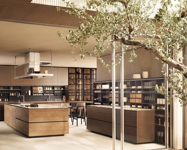 Cucina Design in Noce Canaletto e Marmo Calacatta con isola Artex di Poliform